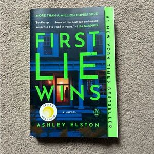 First Lie Wins a Novel by Ashley Elston